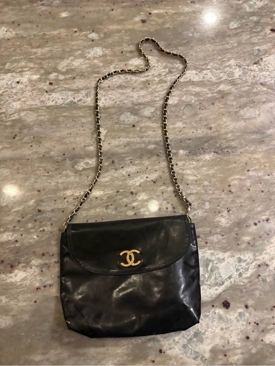 CHANEL Handbags - CHANEL Black Leather Pouch on Chain (WITH COA)